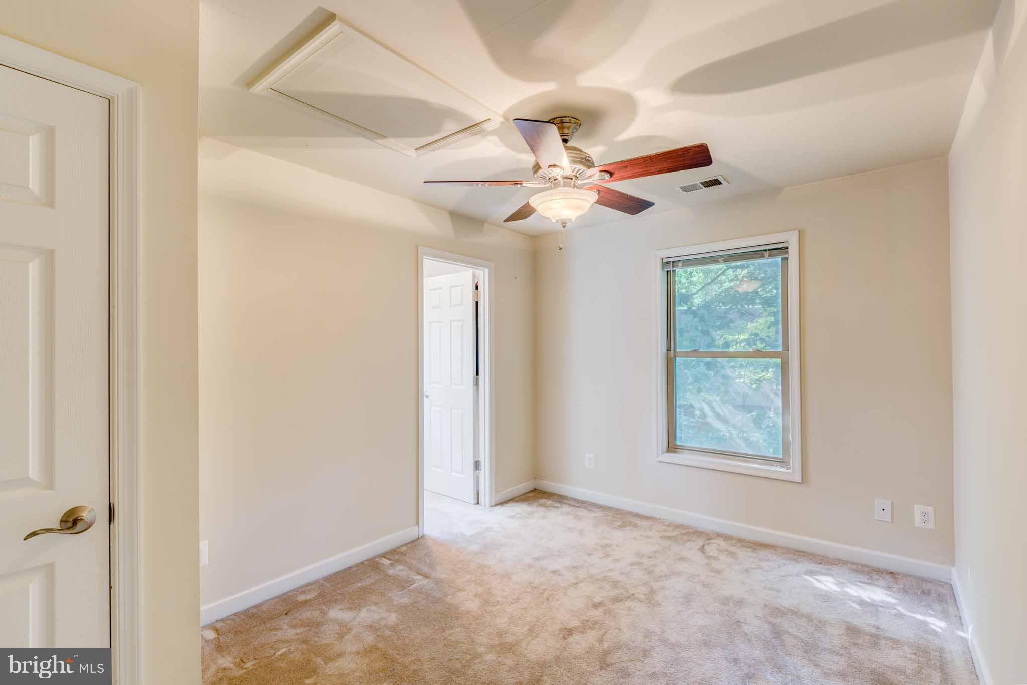 6704 West Lakeridge Road New Market, MD 21774 - Photo 13 of 30 a view of an empty room with a window