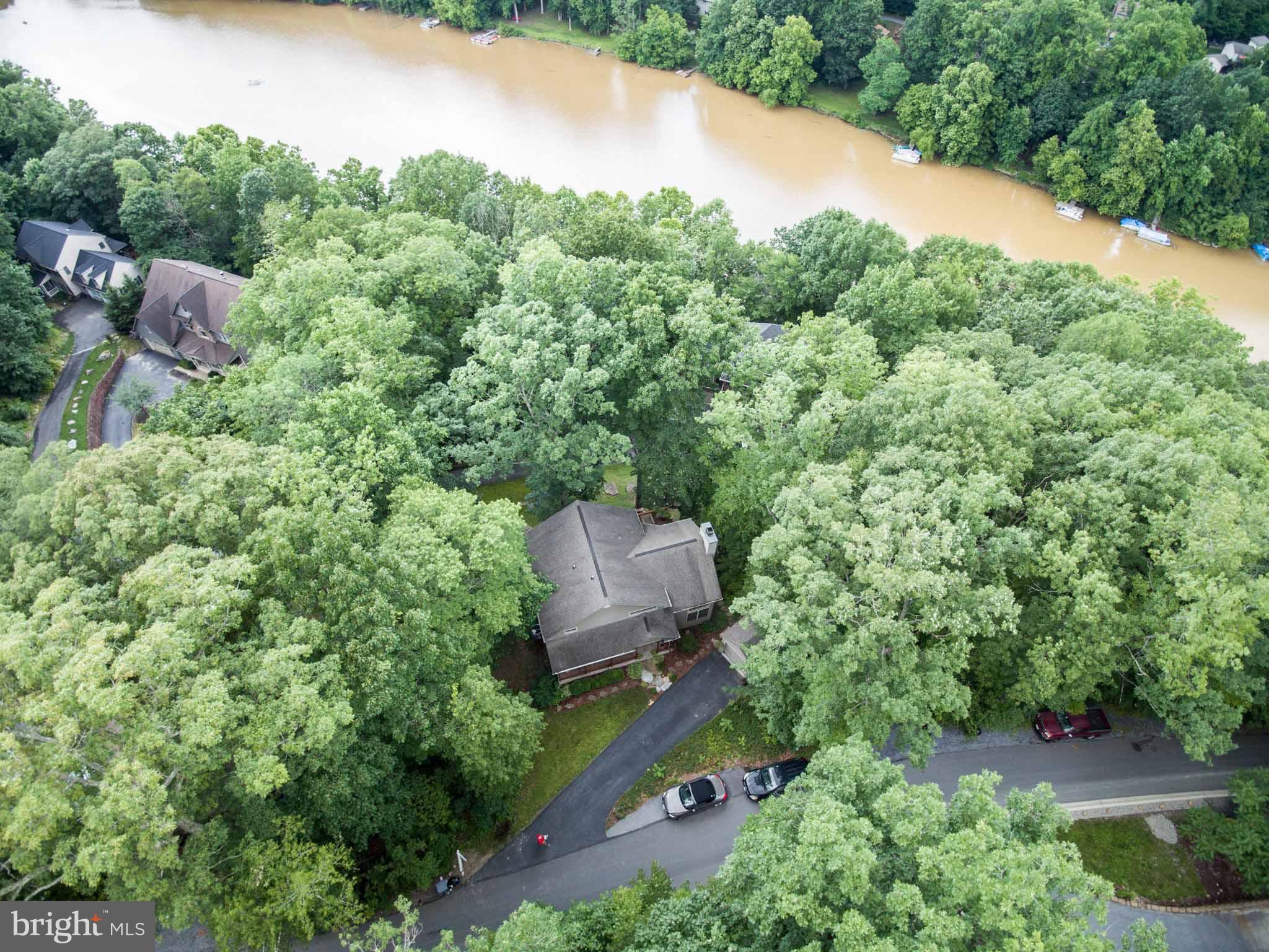 6704 West Lakeridge Road New Market, MD 21774 - Photo 2 of 30 an aerial view of a house with a yard