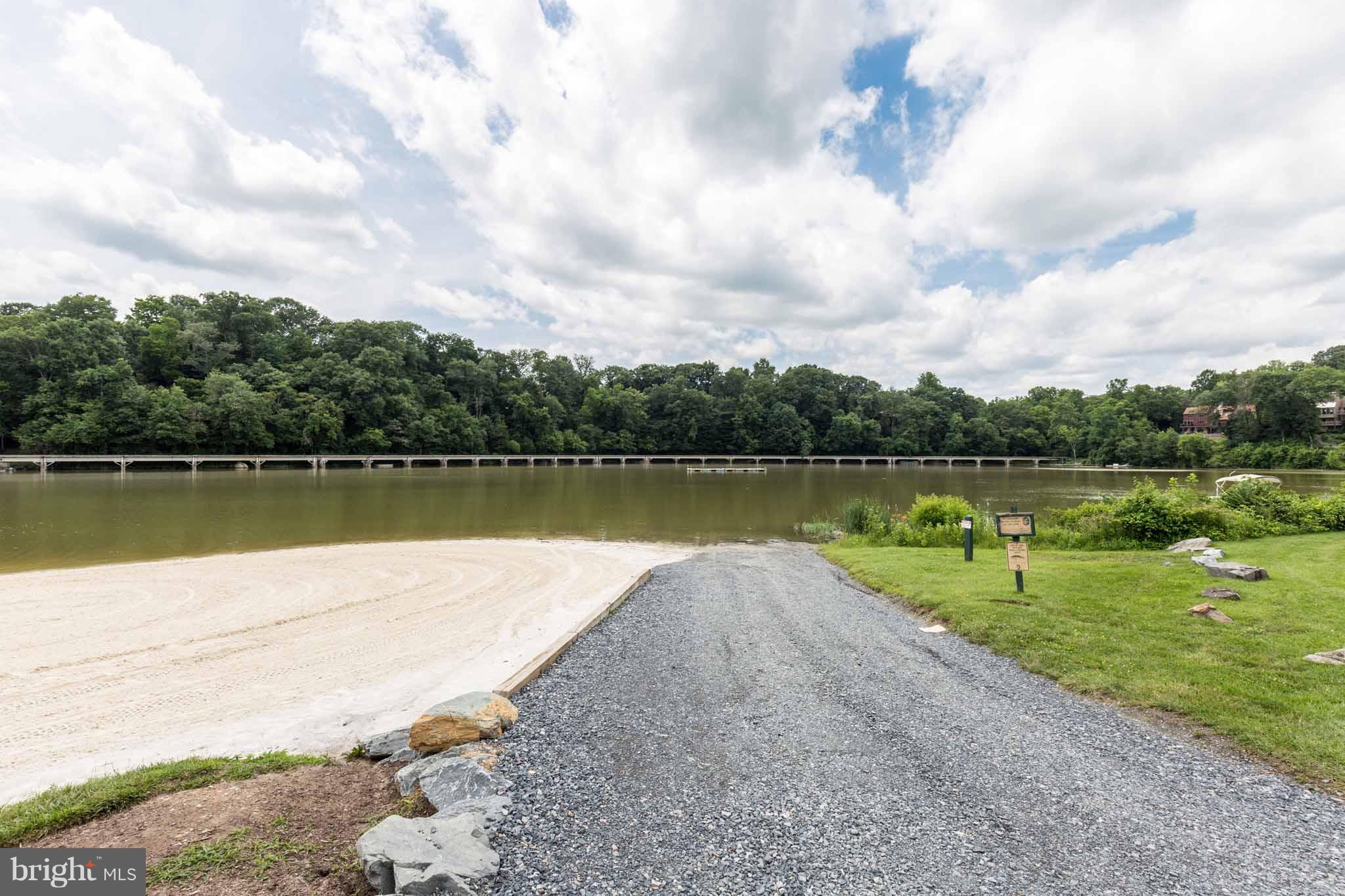 6704 West Lakeridge Road New Market, MD 21774 - Photo 30 of 30 a view of a lake with a big yard