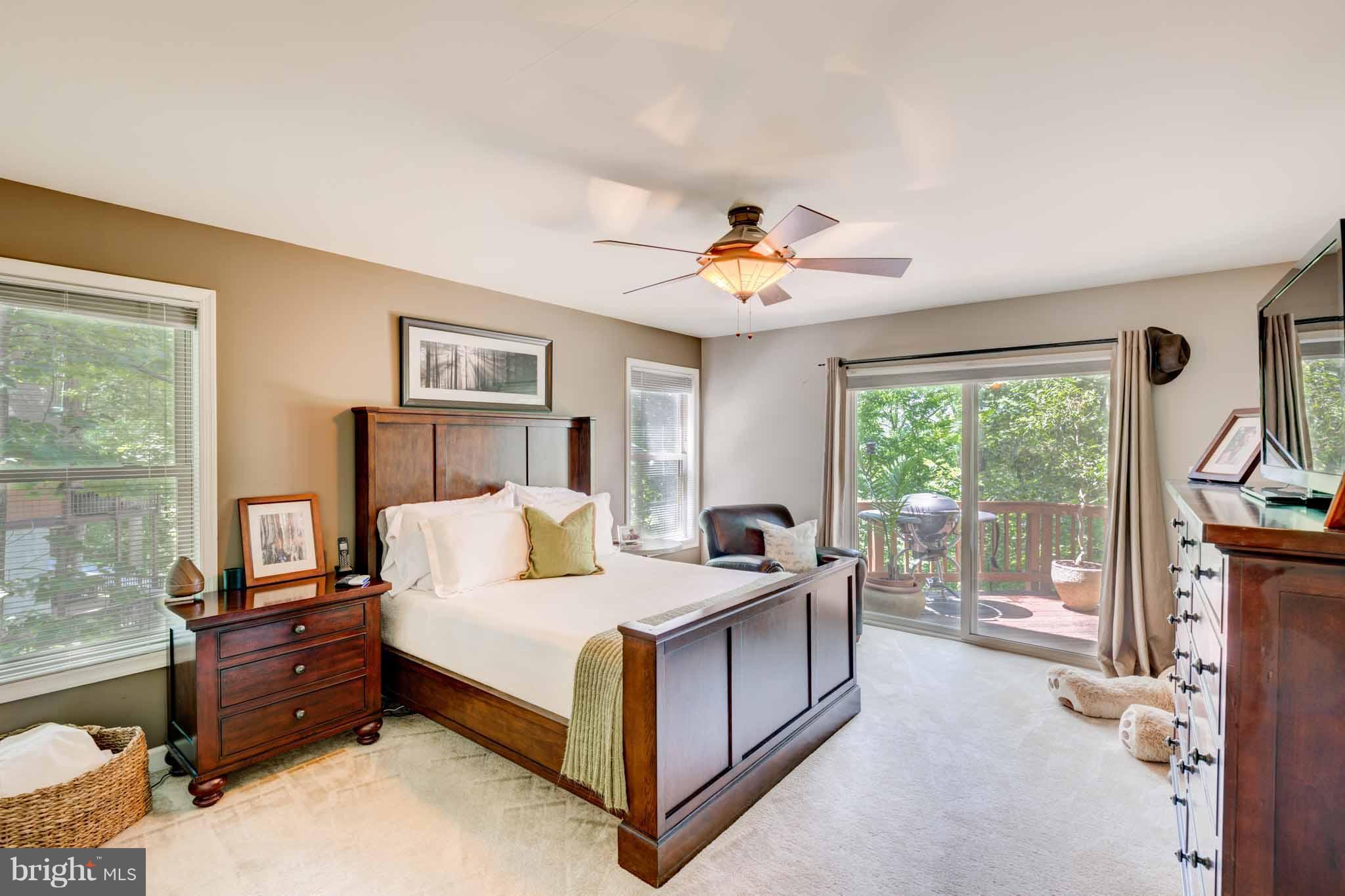 6704 West Lakeridge Road New Market, MD 21774 - Photo 10 of 30 a bed room with a bed and a large window