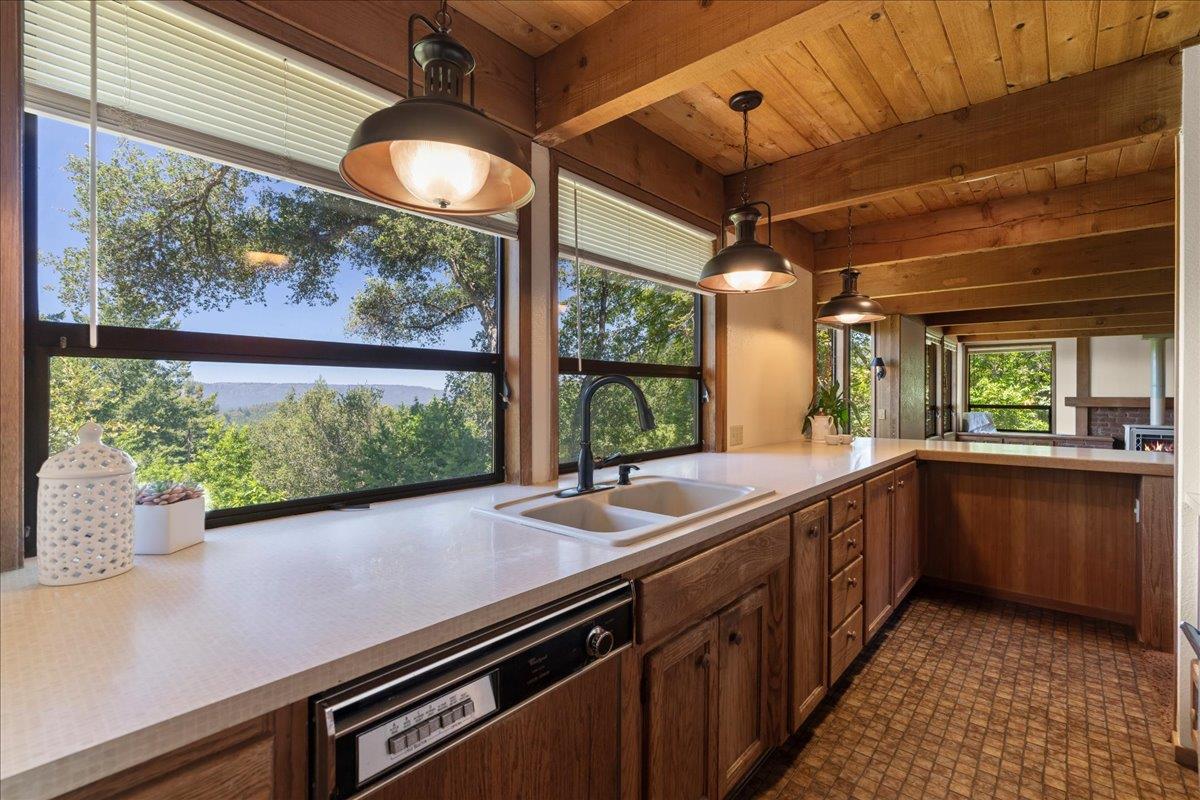 15171 Old Ranch Road Los Gatos, CA 95033 - Photo 9 of 26 a kitchen with a sink and large windows
