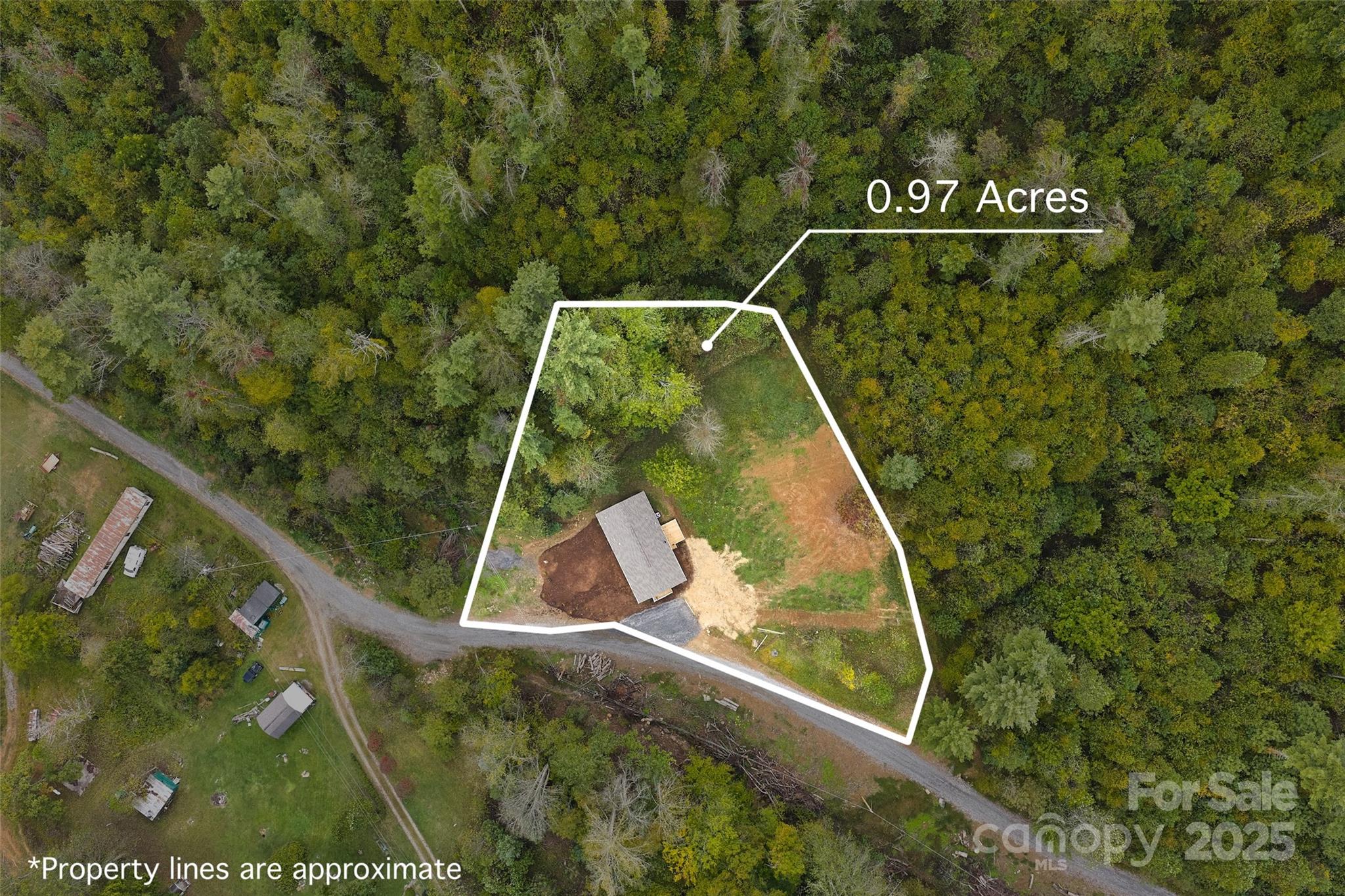 237 Hickory Nut Ridge Road, Unit 10 Burnsville, NC 28714 - Photo 19 of 42 a view of a yard with staircase