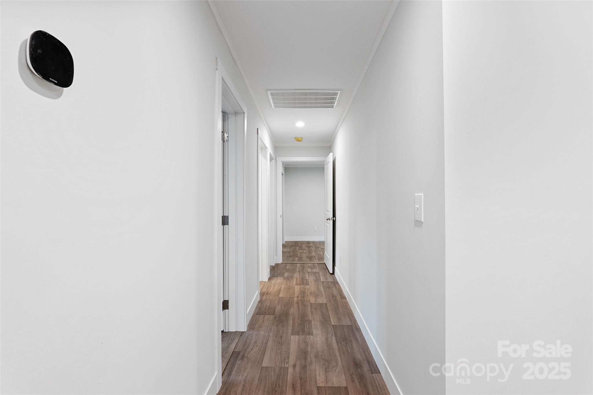 237 Hickory Nut Ridge Road, Unit 10 Burnsville, NC 28714 - Photo 20 of 42 a view of hallway with wooden floor