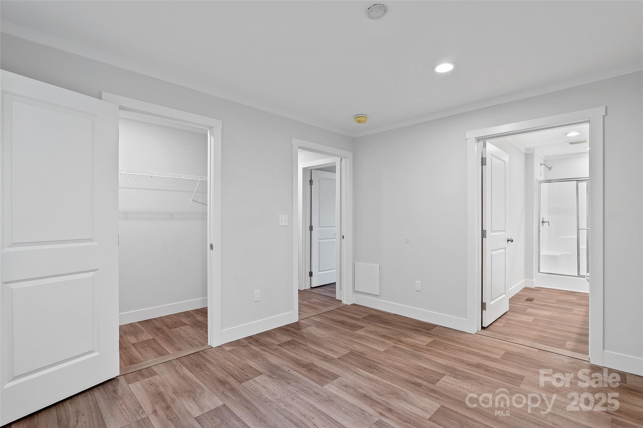 237 Hickory Nut Ridge Road, Unit 10 Burnsville, NC 28714 - Photo 29 of 42 a view of empty room with wooden floor