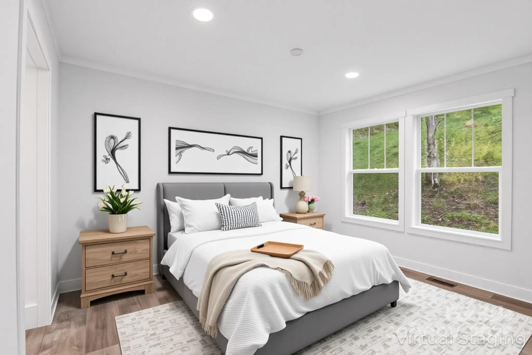 237 Hickory Nut Ridge Road, Unit 10 Burnsville, NC 28714 - Photo 31 of 42 a bedroom with a bed and a large window