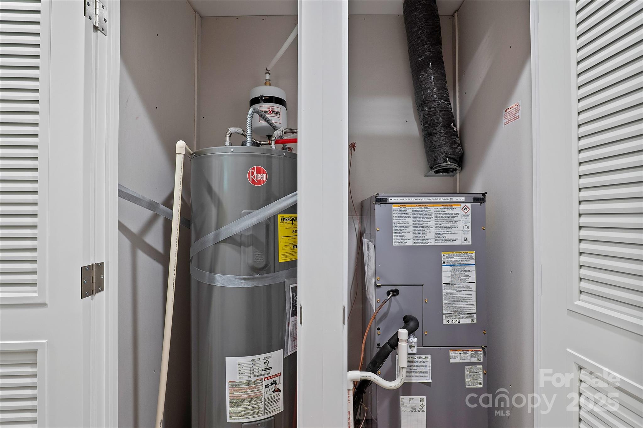 237 Hickory Nut Ridge Road, Unit 10 Burnsville, NC 28714 - Photo 33 of 42 a view of storage and utility room with washer and dryer