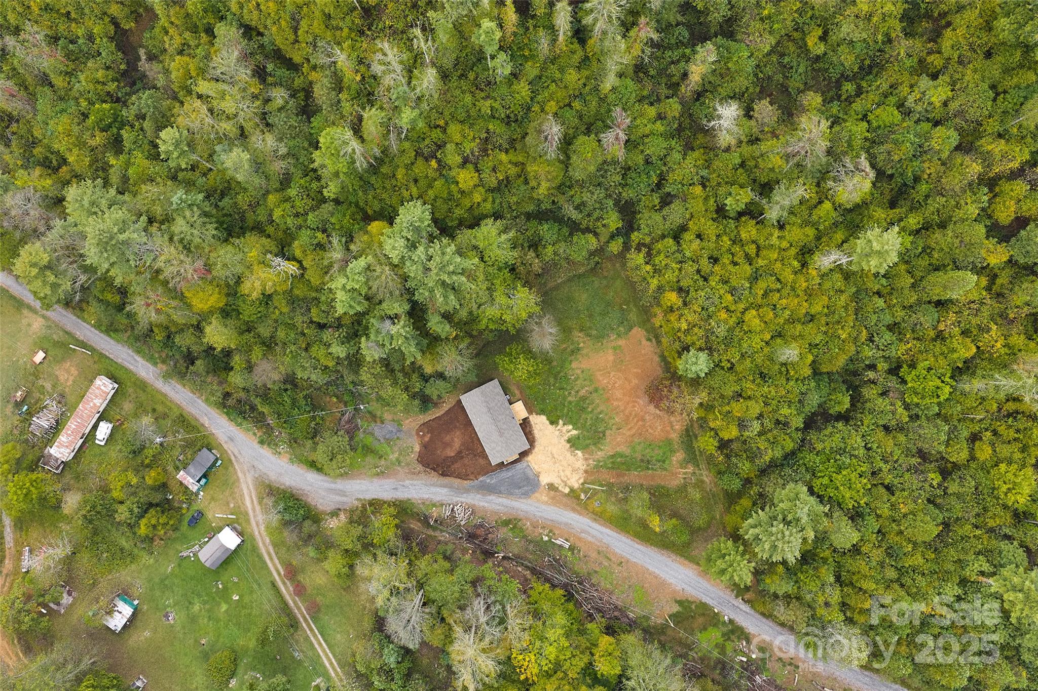 237 Hickory Nut Ridge Road, Unit 10 Burnsville, NC 28714 - Photo 38 of 42 a view of a garden from a balcony