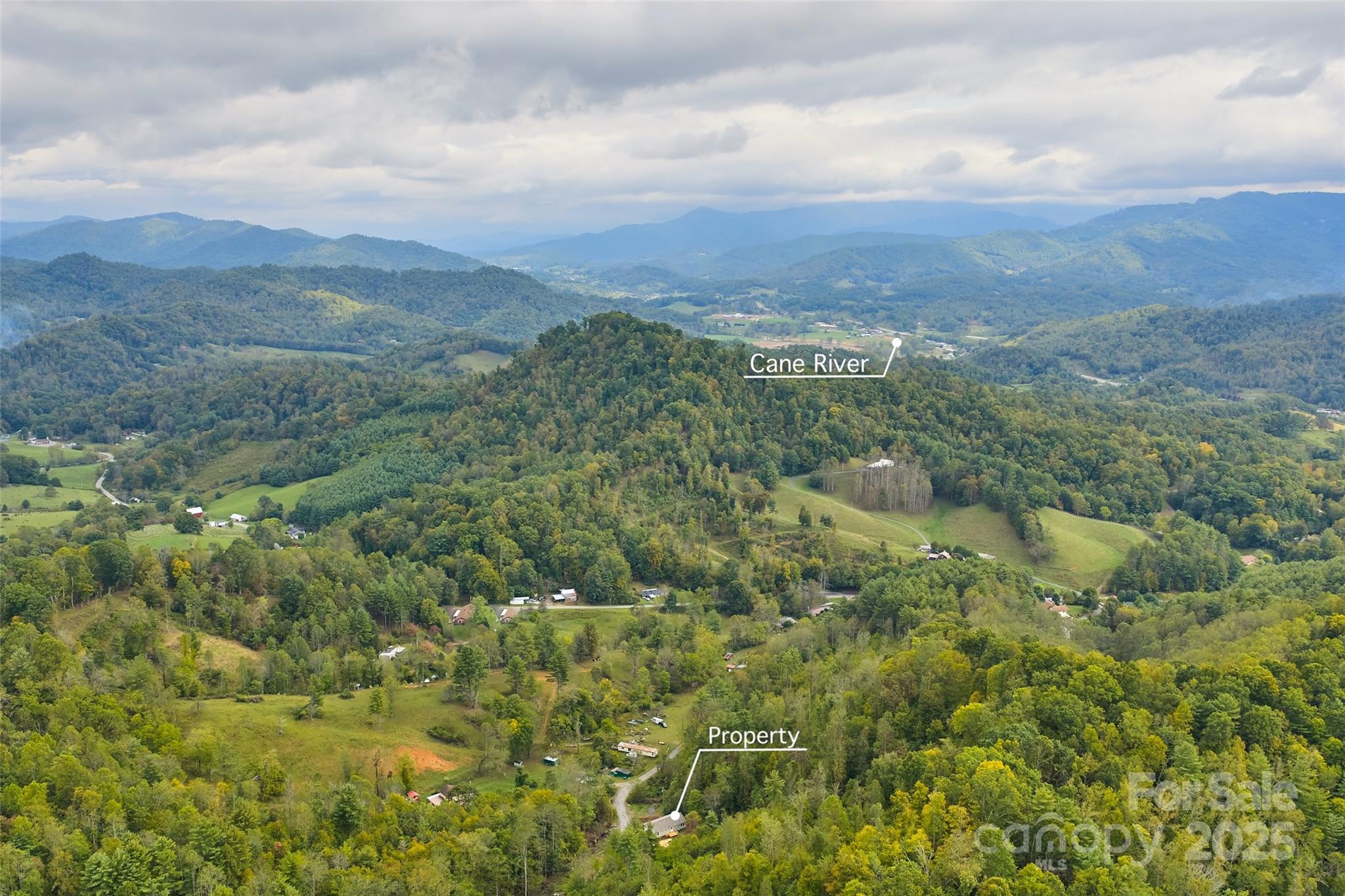 237 Hickory Nut Ridge Road, Unit 10 Burnsville, NC 28714 - Photo 40 of 42 a view of a city and mountains