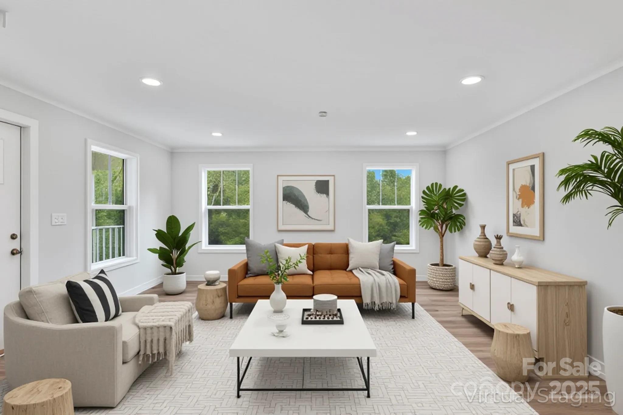 237 Hickory Nut Ridge Road, Unit 10 Burnsville, NC 28714 - Photo 5 of 42 a living room with furniture and a large window