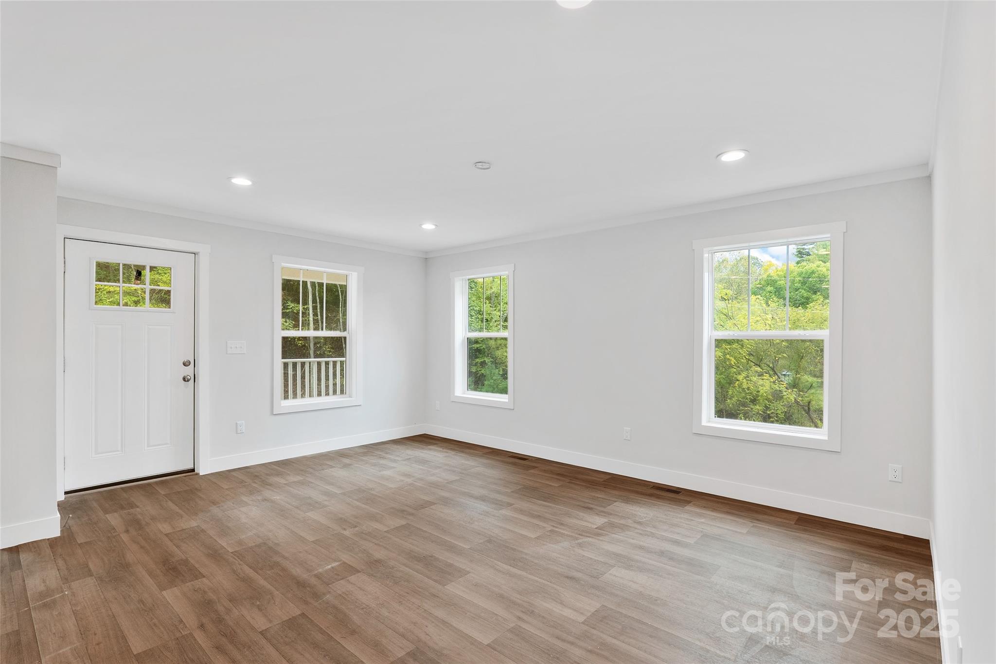 237 Hickory Nut Ridge Road, Unit 10 Burnsville, NC 28714 - Photo 7 of 42 a view of an empty room with a window