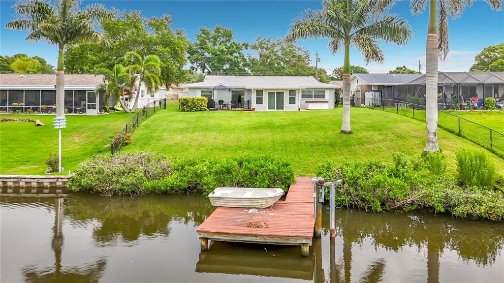 508 Shore Drive Largo, FL 33771 - Photo 26 of 31 a view of a house with a yard and a garden
