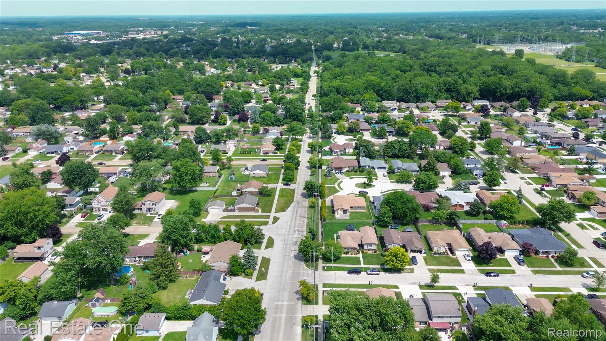 44220 Saltz Road Canton, MI 48187 - Photo 31 of 31 Aerial perspective showcasing a residential neighborhood with tree-lined streets and individual properties
