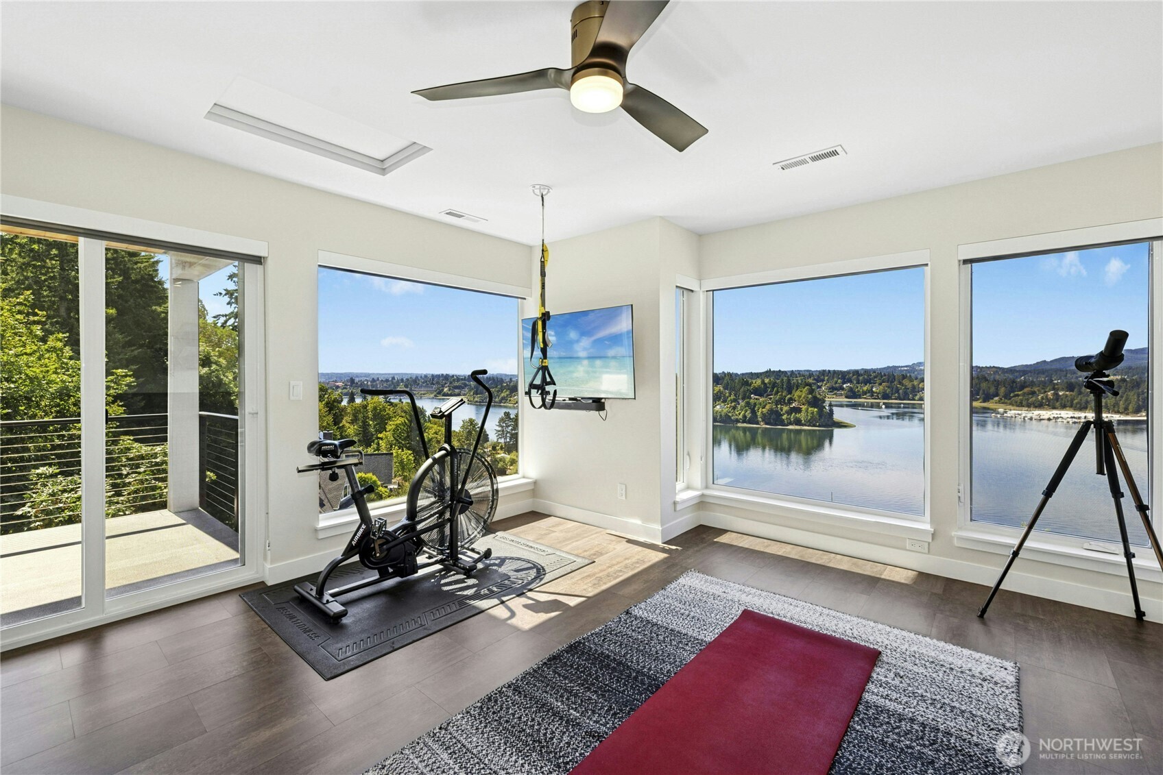 3347 Amak Lane Bremerton, WA 98310 - Photo 16 of 36 a view of a livingroom with furniture wooden floor and a floor to ceiling window