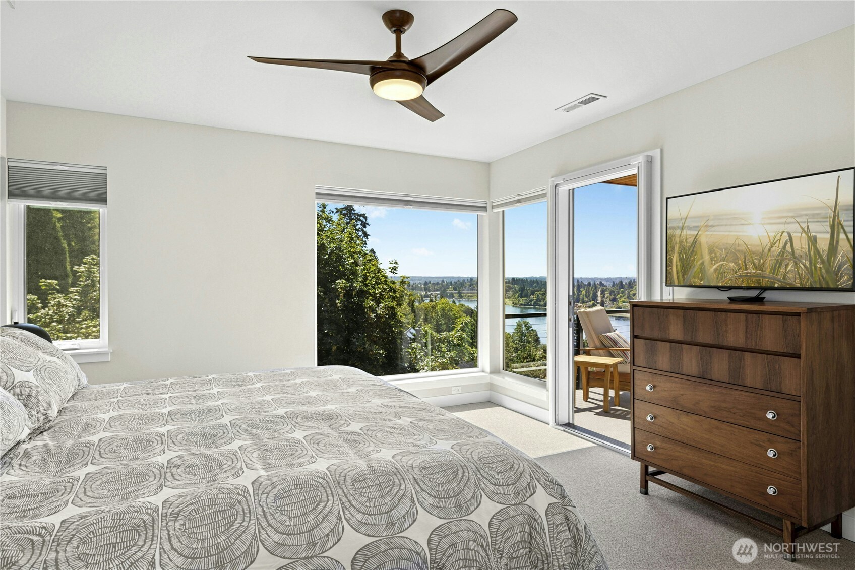 3347 Amak Lane Bremerton, WA 98310 - Photo 20 of 36 a bedroom with a large bed and a flat tv screen