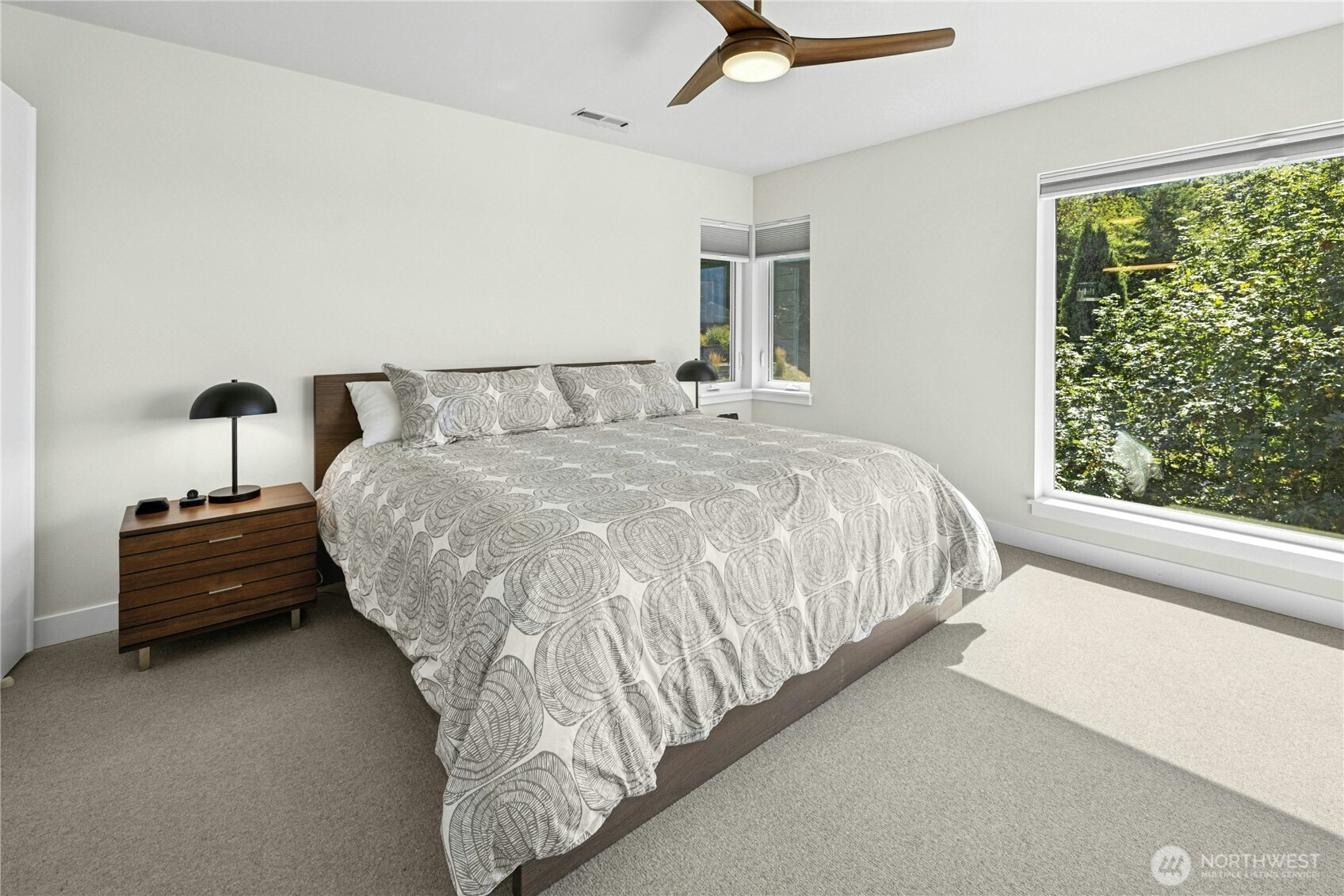 3347 Amak Lane Bremerton, WA 98310 - Photo 21 of 36 a bed sitting in a spacious bedroom next to a window