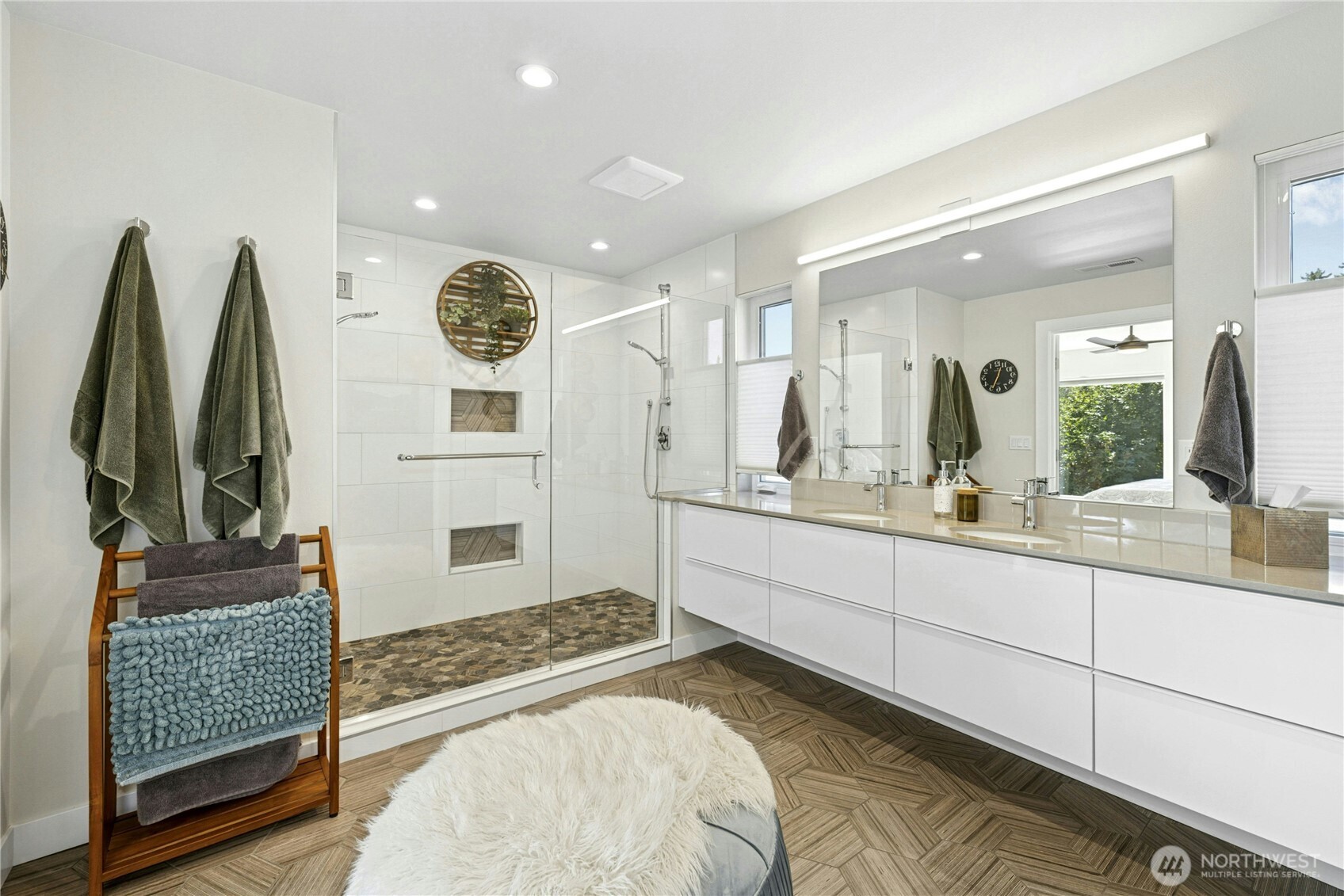 3347 Amak Lane Bremerton, WA 98310 - Photo 23 of 36 a spacious bathroom with a double vanity sink and a mirror