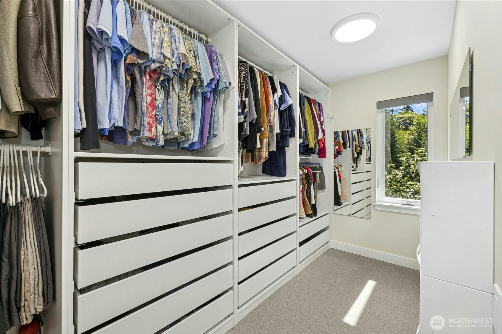 3347 Amak Lane Bremerton, WA 98310 - Photo 24 of 36 a view of walk in closet with clothes and shoes
