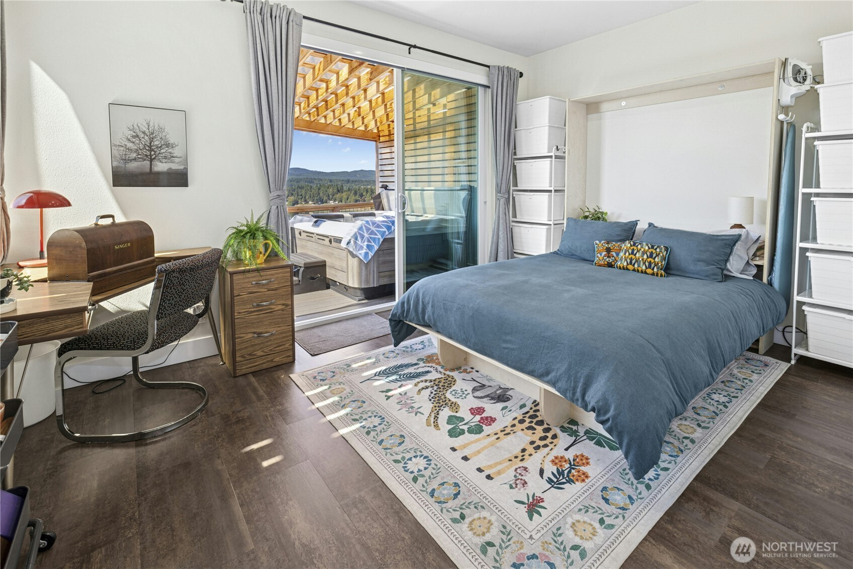 3347 Amak Lane Bremerton, WA 98310 - Photo 25 of 36 a bedroom with a bed and wooden floor