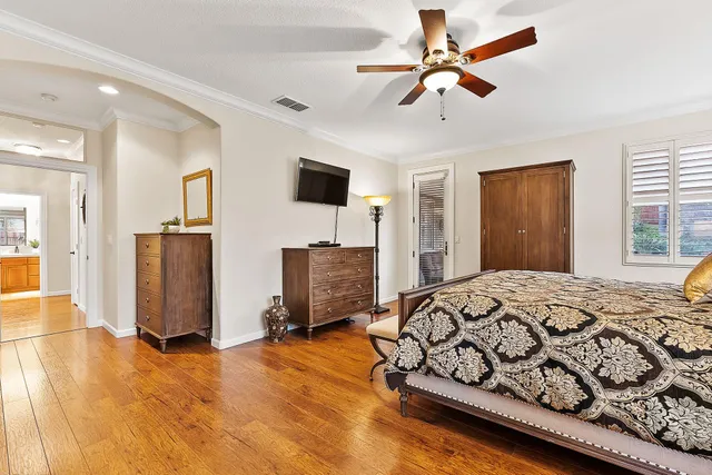 a bedroom with a bed closet and a window