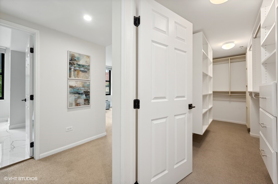 55 West Delaware Place, Unit 415 Chicago, IL 60610 - Photo 25 of 41 a bathroom with a shower and a glass door