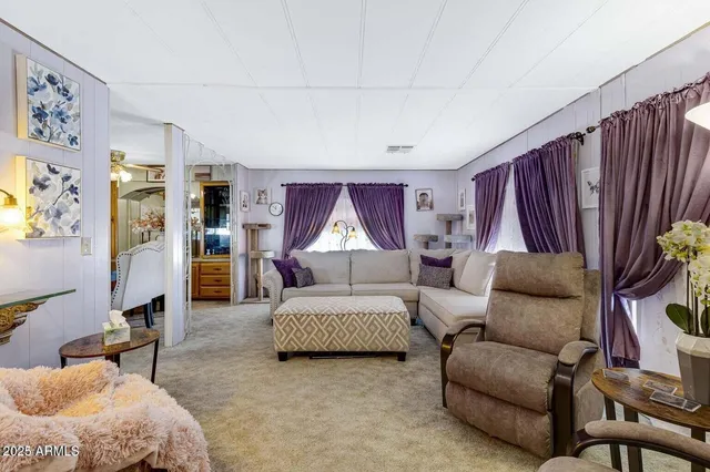 a bedroom with furniture and a lamp