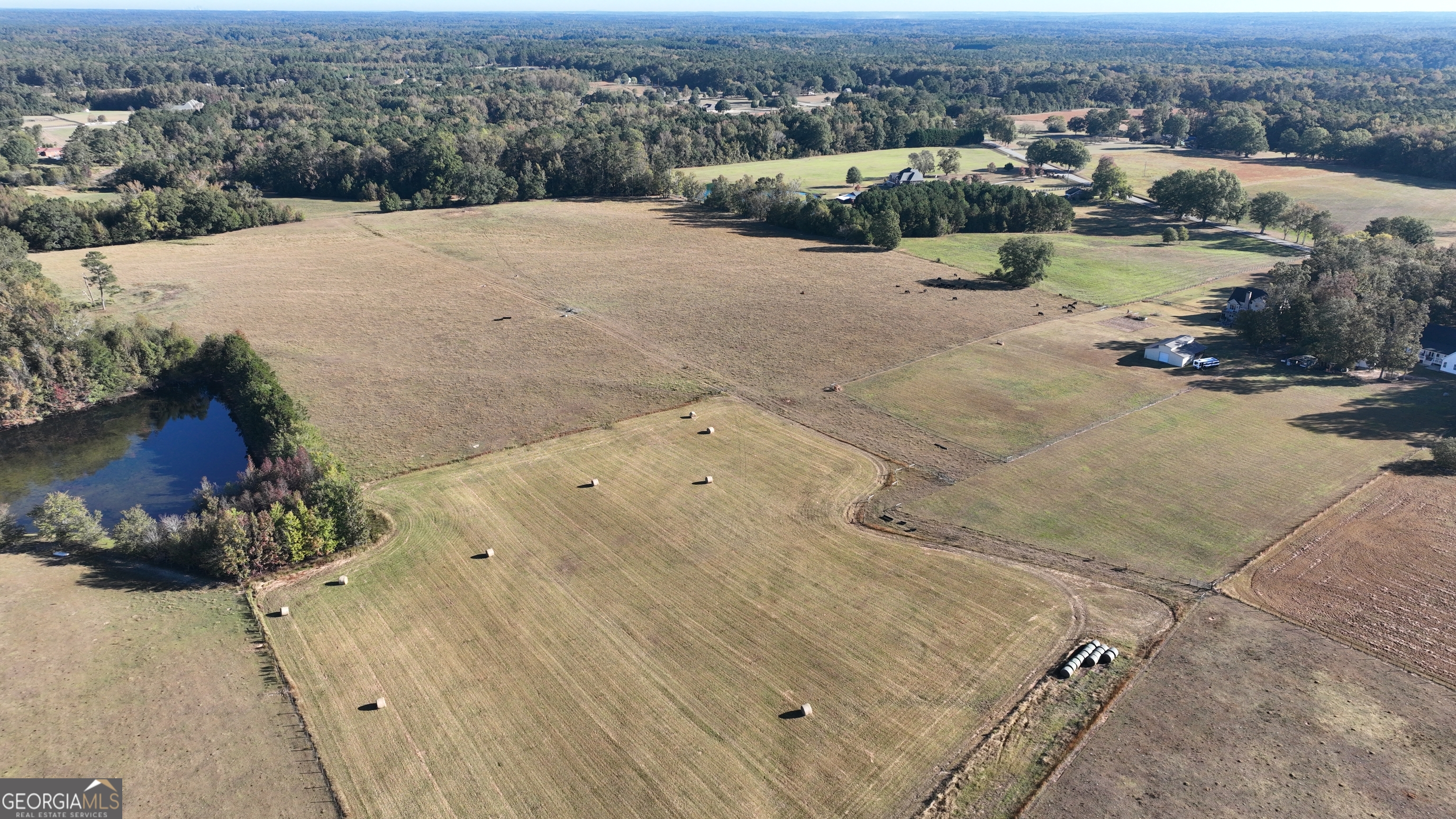 Lot 5 Mask Road Brooks, GA 30205 - Photo 4 of 13 an aerial view of a house with a yard and lake view in back