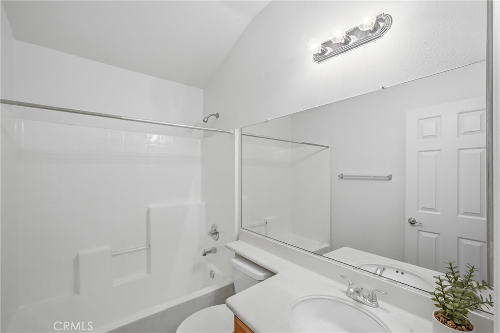 8710 Windmill Place Riverside, CA 92508 - Photo 46 of 66 a bathroom with a sink toilet and shower