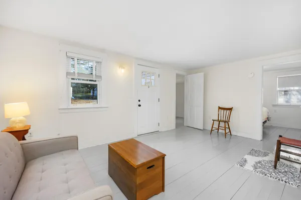 a view of a dining room with furniture and window