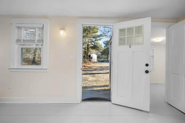a view of washer and dryer with kitchen in the background