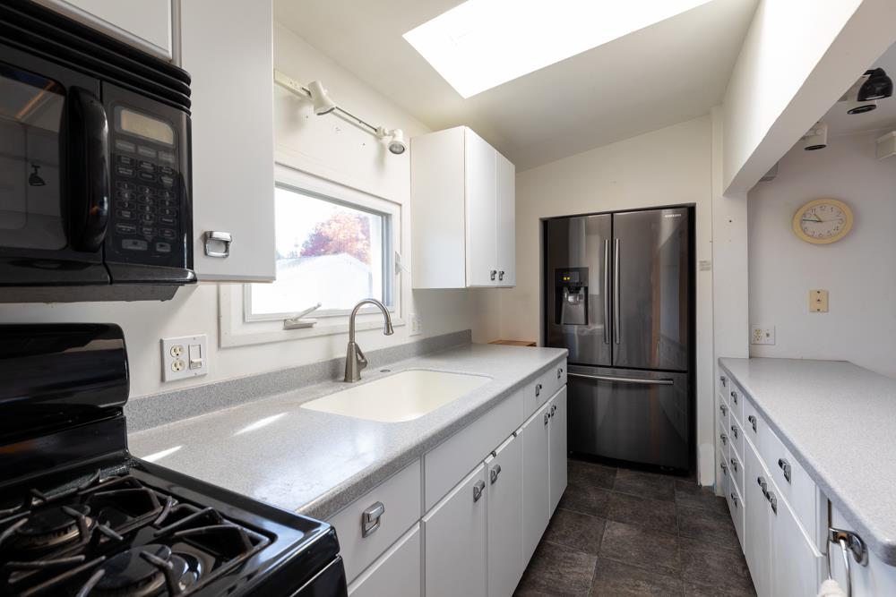 3010 North Main Street Soquel, CA 95073 - Photo 13 of 32 a kitchen with a sink stove and refrigerator