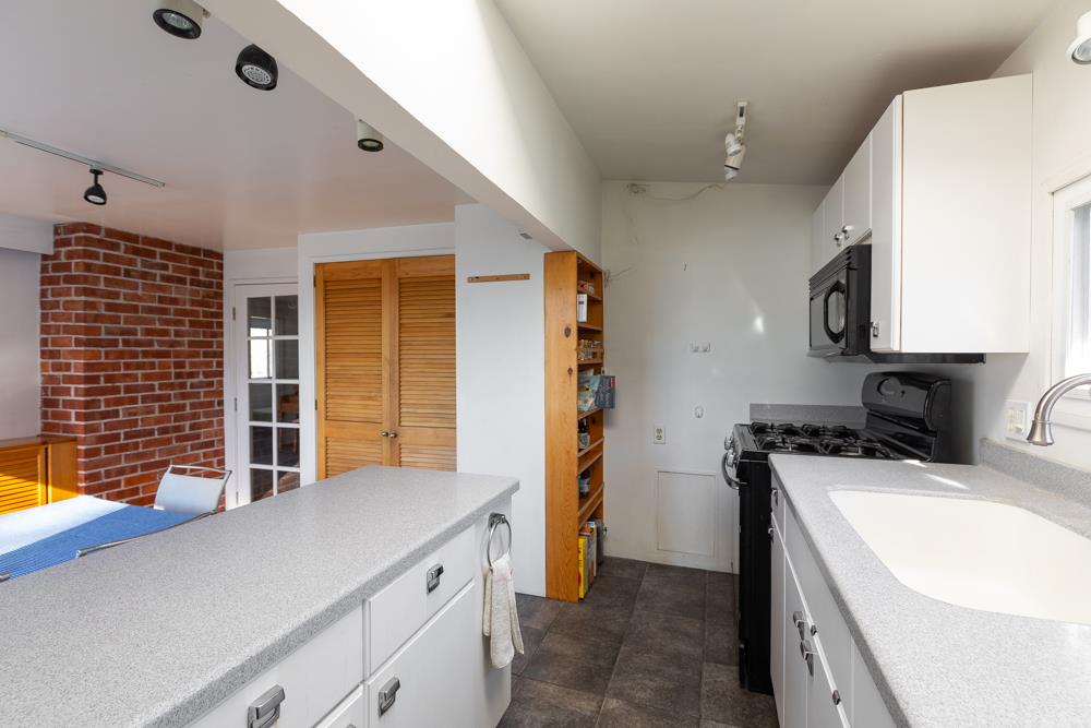 3010 North Main Street Soquel, CA 95073 - Photo 14 of 32 a kitchen with a sink a stove and a refrigerator