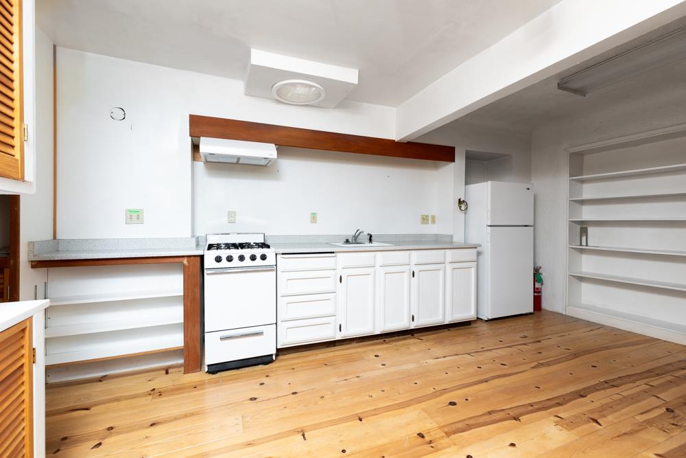 3010 North Main Street Soquel, CA 95073 - Photo 18 of 32 a kitchen with white cabinets and a sink