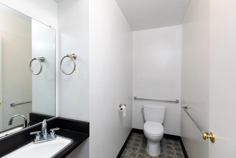 3010 North Main Street Soquel, CA 95073 - Photo 21 of 32 a bathroom with a sink toilet and a mirror