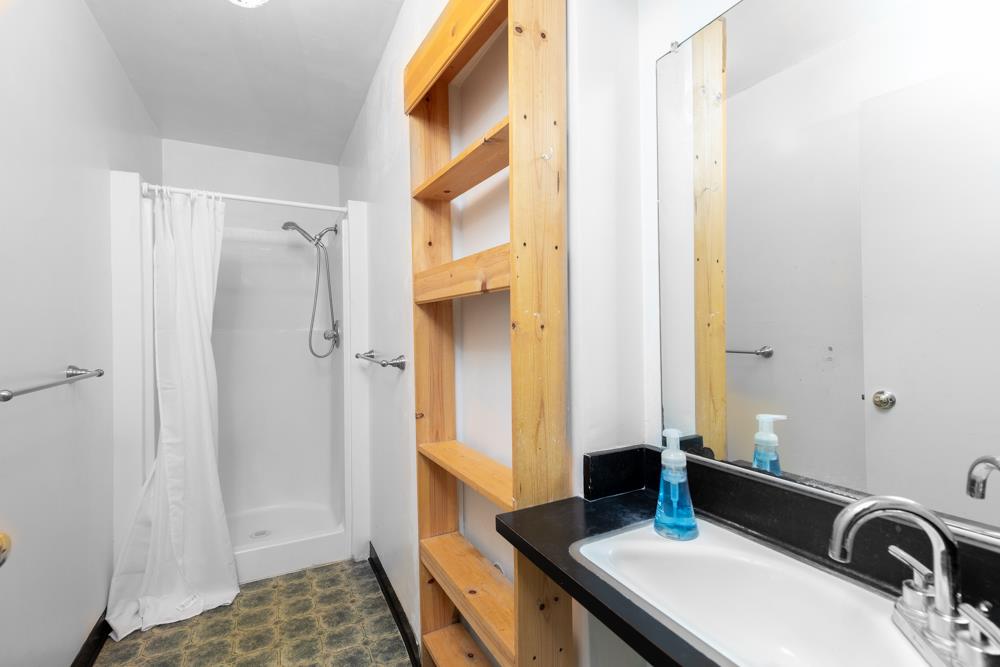 3010 North Main Street Soquel, CA 95073 - Photo 22 of 32 a bathroom with a sink and a mirror