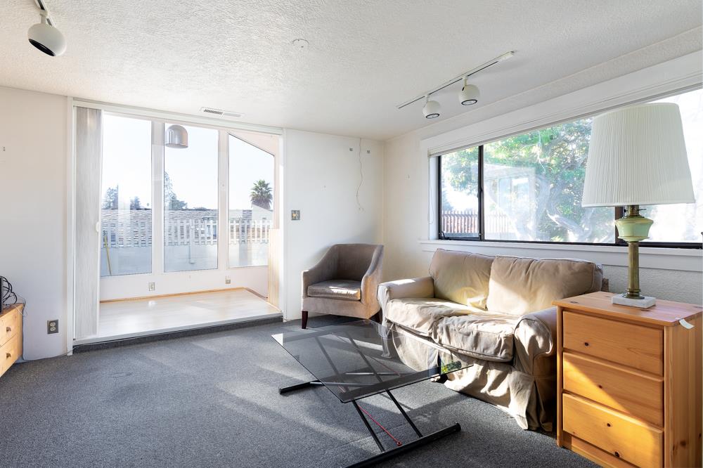 3010 North Main Street Soquel, CA 95073 - Photo 4 of 32 a living room with furniture and a large window