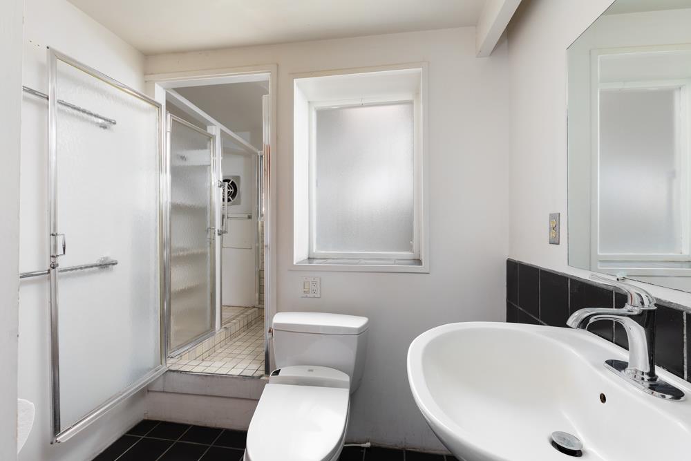 3010 North Main Street Soquel, CA 95073 - Photo 10 of 32 a bathroom with a sink toilet and shower