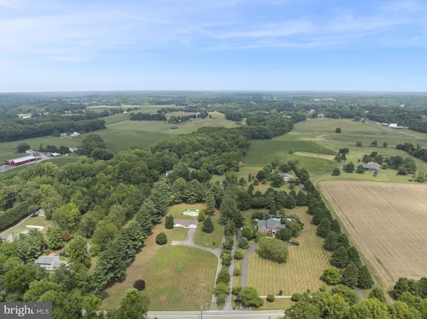 an aerial view of a houses with outdoor space
