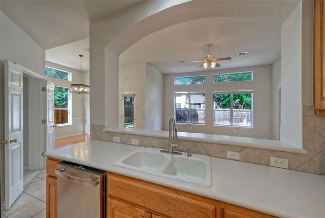a bathroom with a sink and a window