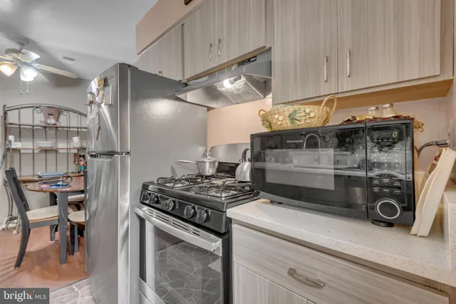 a kitchen with a stove and a refrigerator