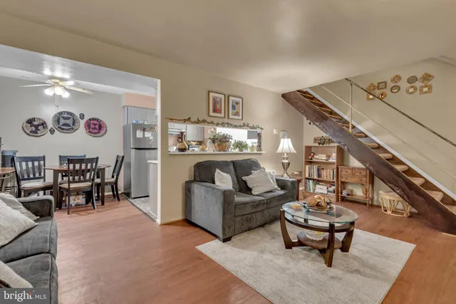 a living room with furniture and a rug
