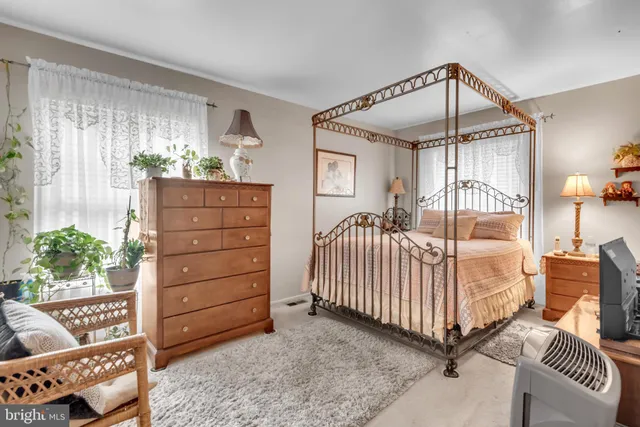 a bedroom with furniture and a window