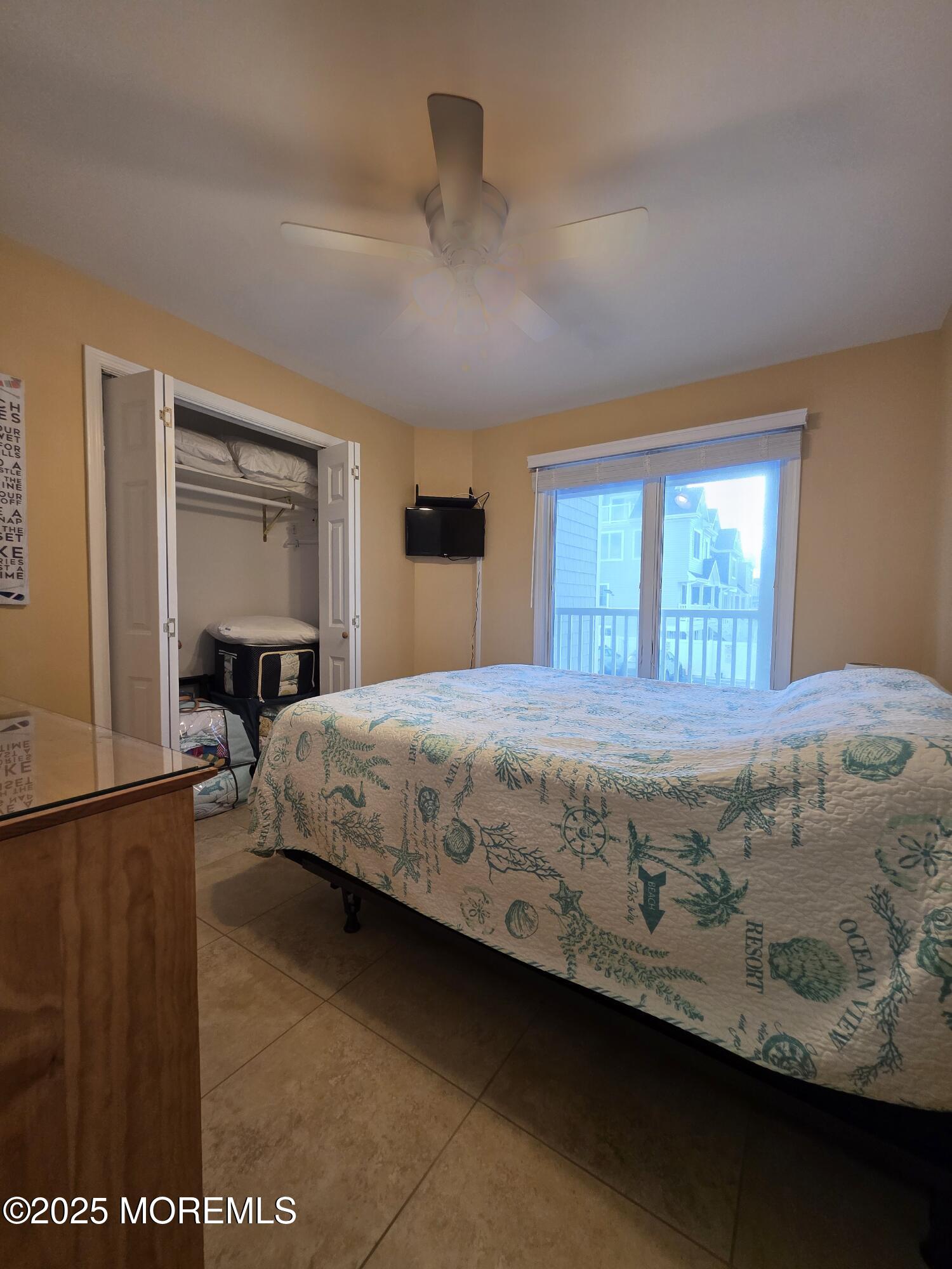37 Dune Terrace Seaside Heights, NJ 08751 - Photo 11 of 16 a bedroom with a bed and window