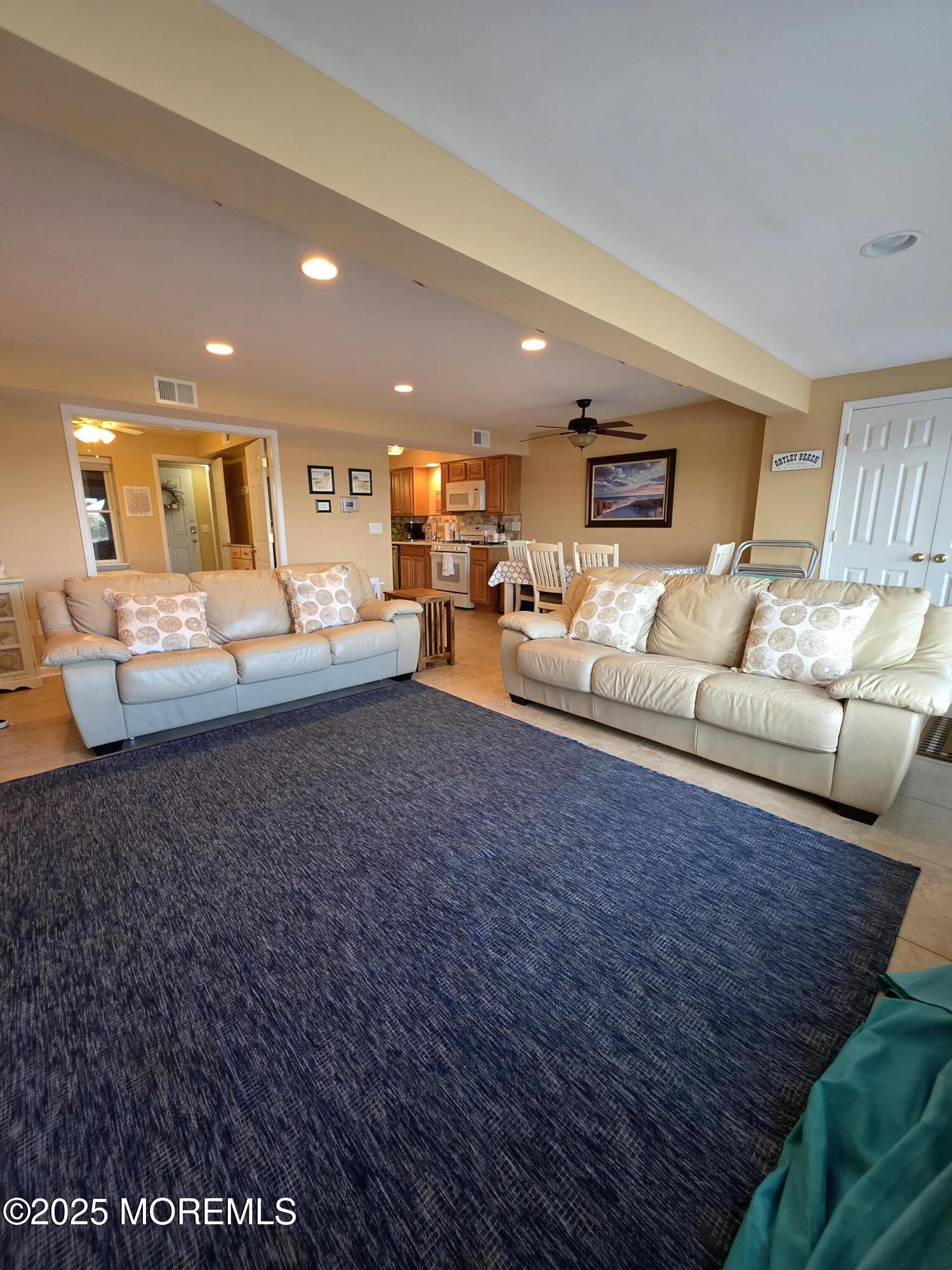 37 Dune Terrace Seaside Heights, NJ 08751 - Photo 4 of 16 a living room with furniture and a couch