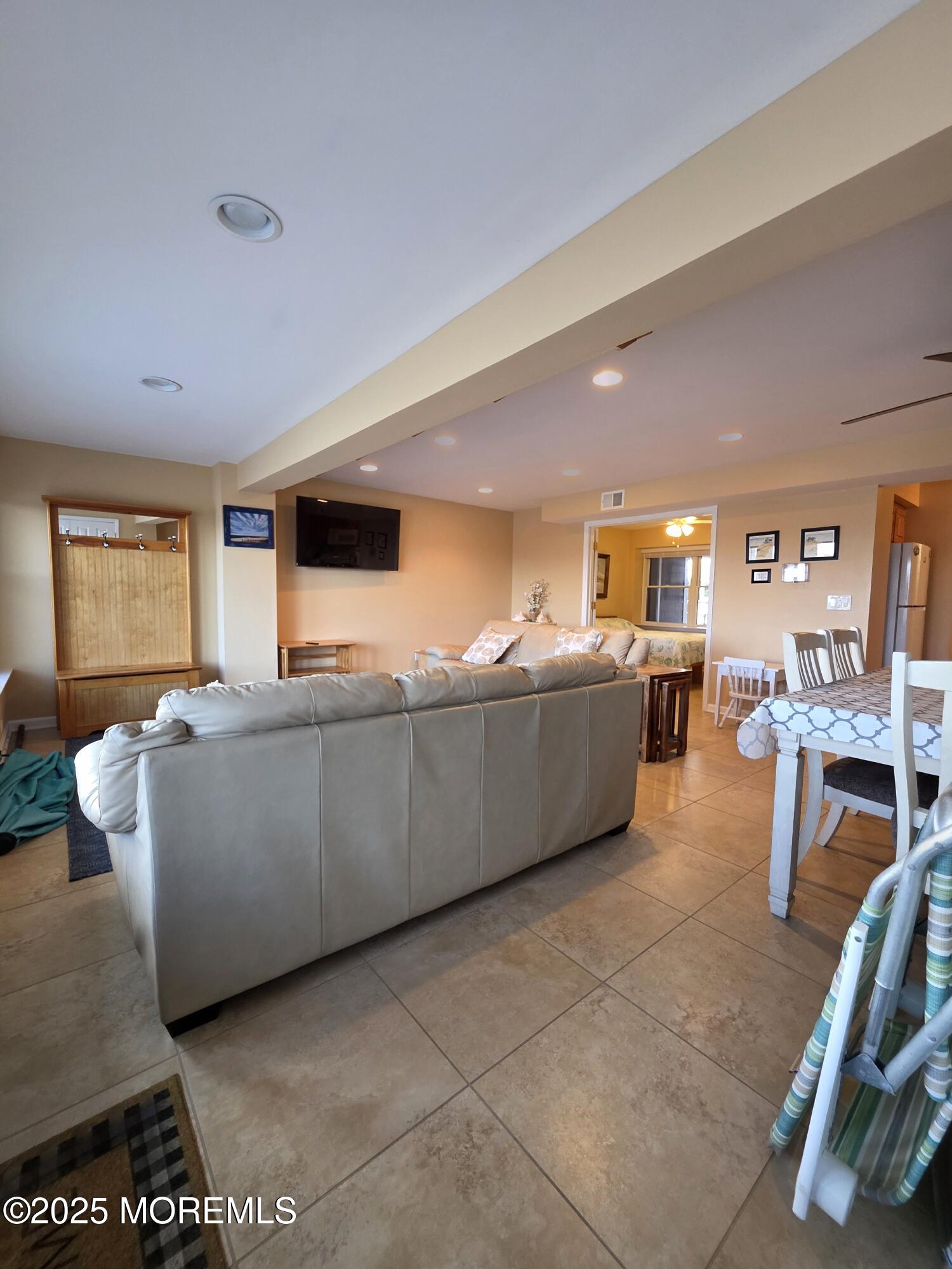 37 Dune Terrace Seaside Heights, NJ 08751 - Photo 5 of 16 a living room with furniture and a flat screen tv