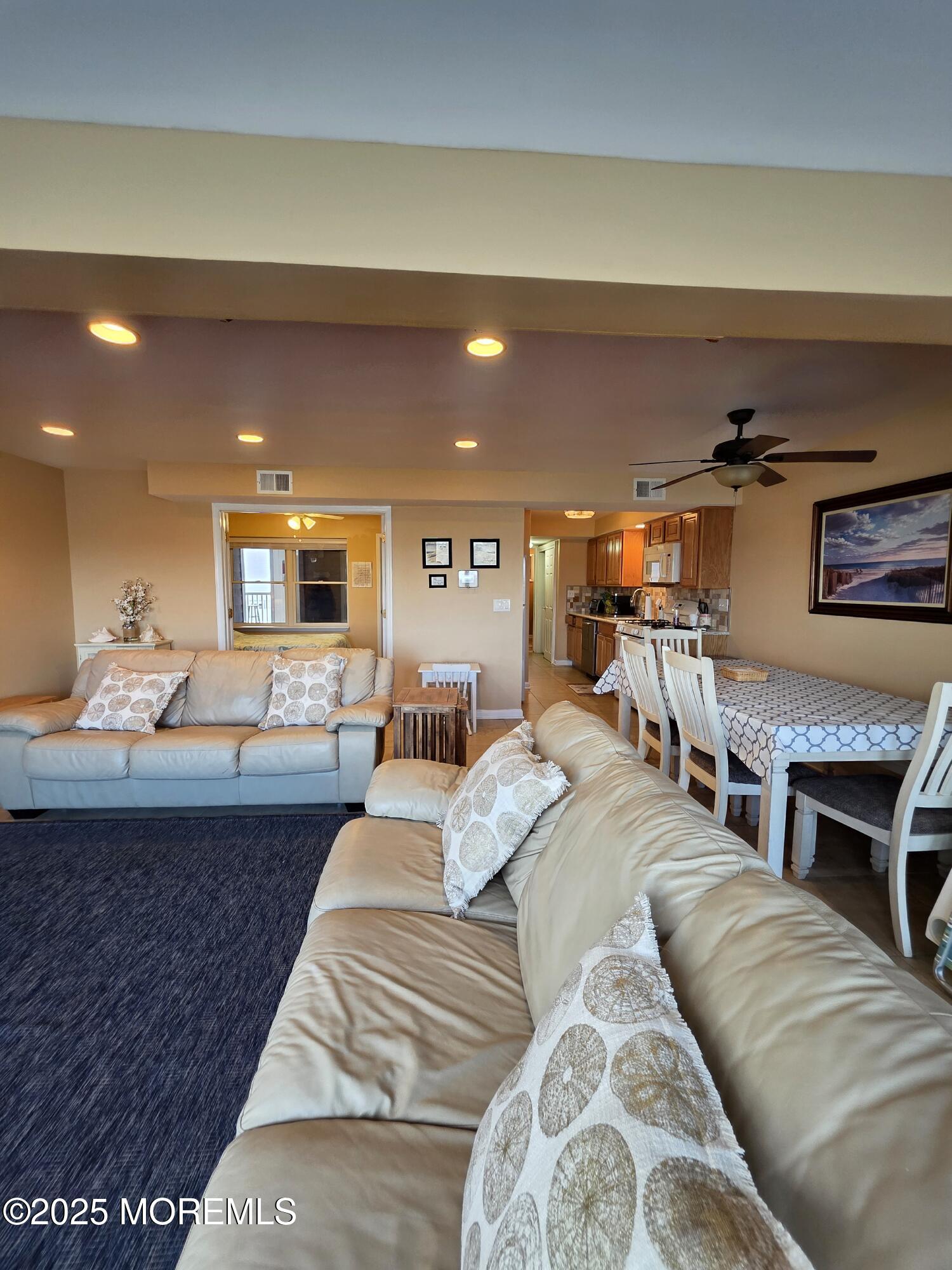 37 Dune Terrace Seaside Heights, NJ 08751 - Photo 8 of 16 a living room with furniture and a fireplace