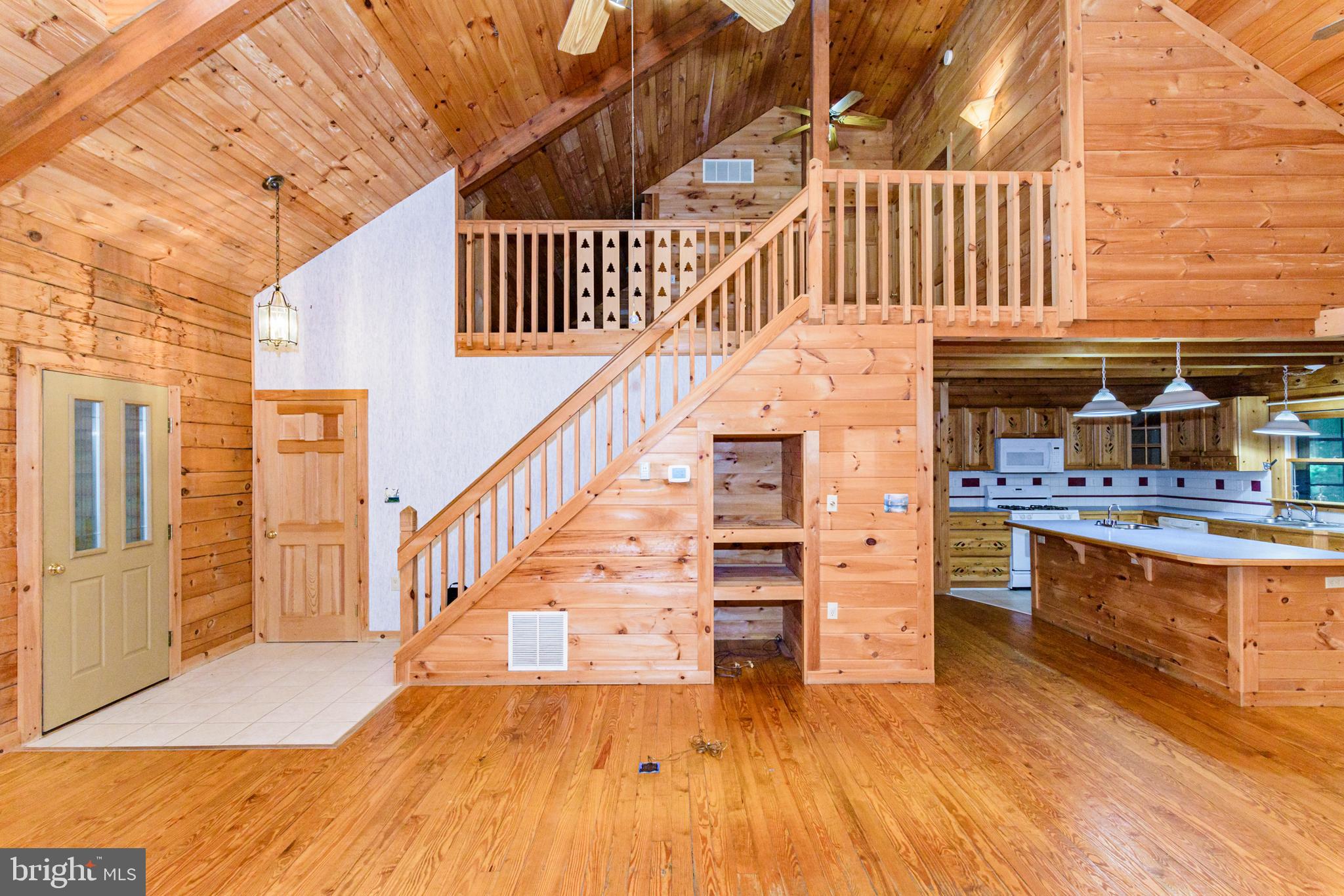 135 Windjammer Road Berlin, MD 21811 - Photo 22 of 76 a view of entryway and hall with wooden floor