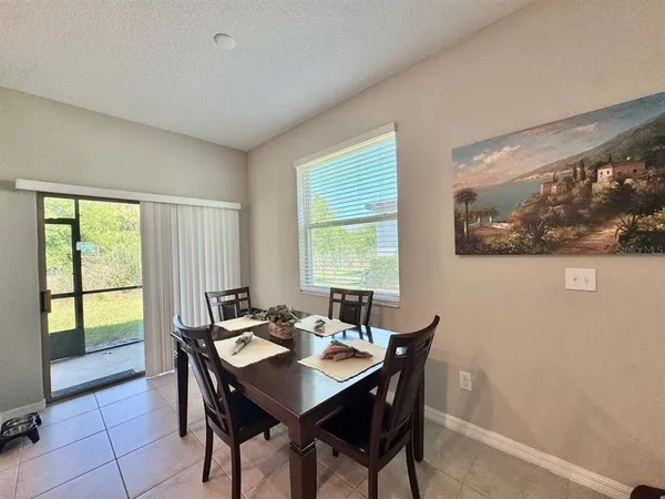 a view of a dining room with furniture window and outside view