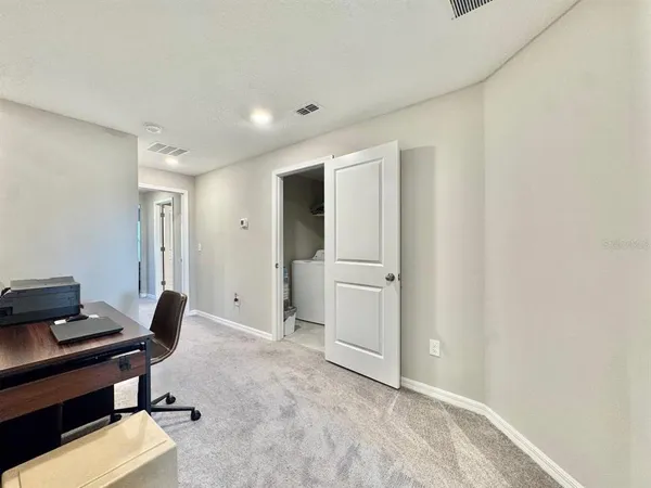 a view of workspace with livingroom view