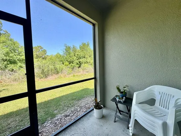a view of a room with a large window