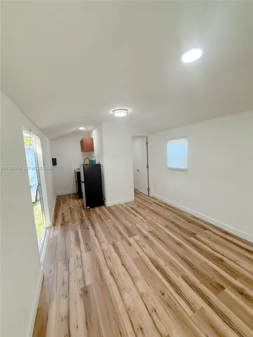 a bedroom with a bed and a mirror